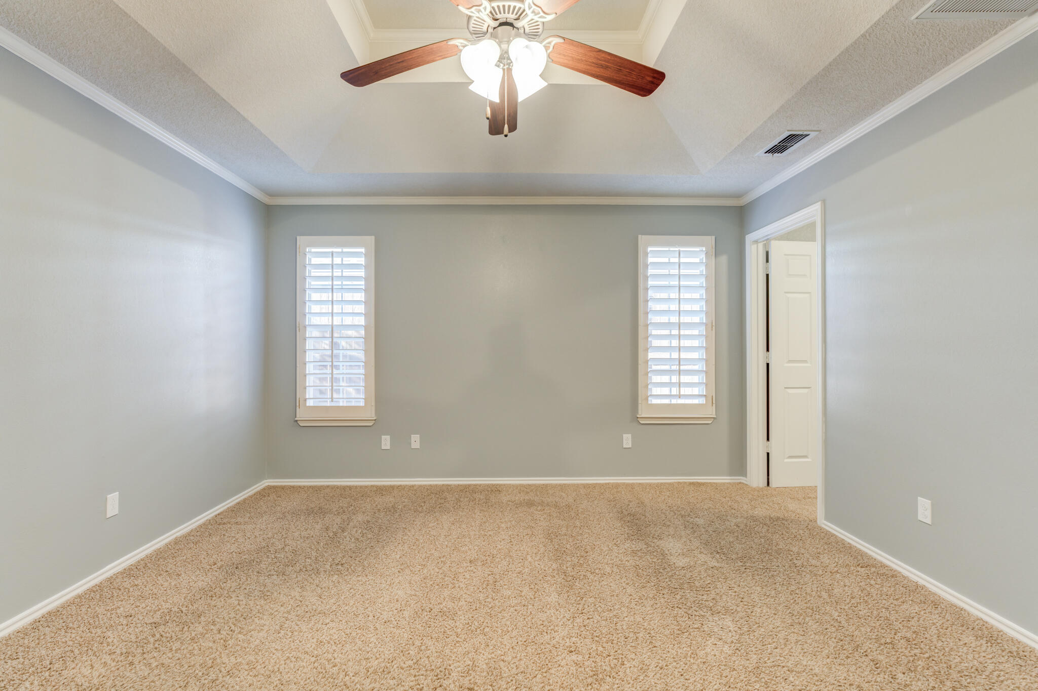 5407 68th Street Lubbock, TX 79424 - Photo 25 of 40 a view of a livingroom with a ceiling fan and window