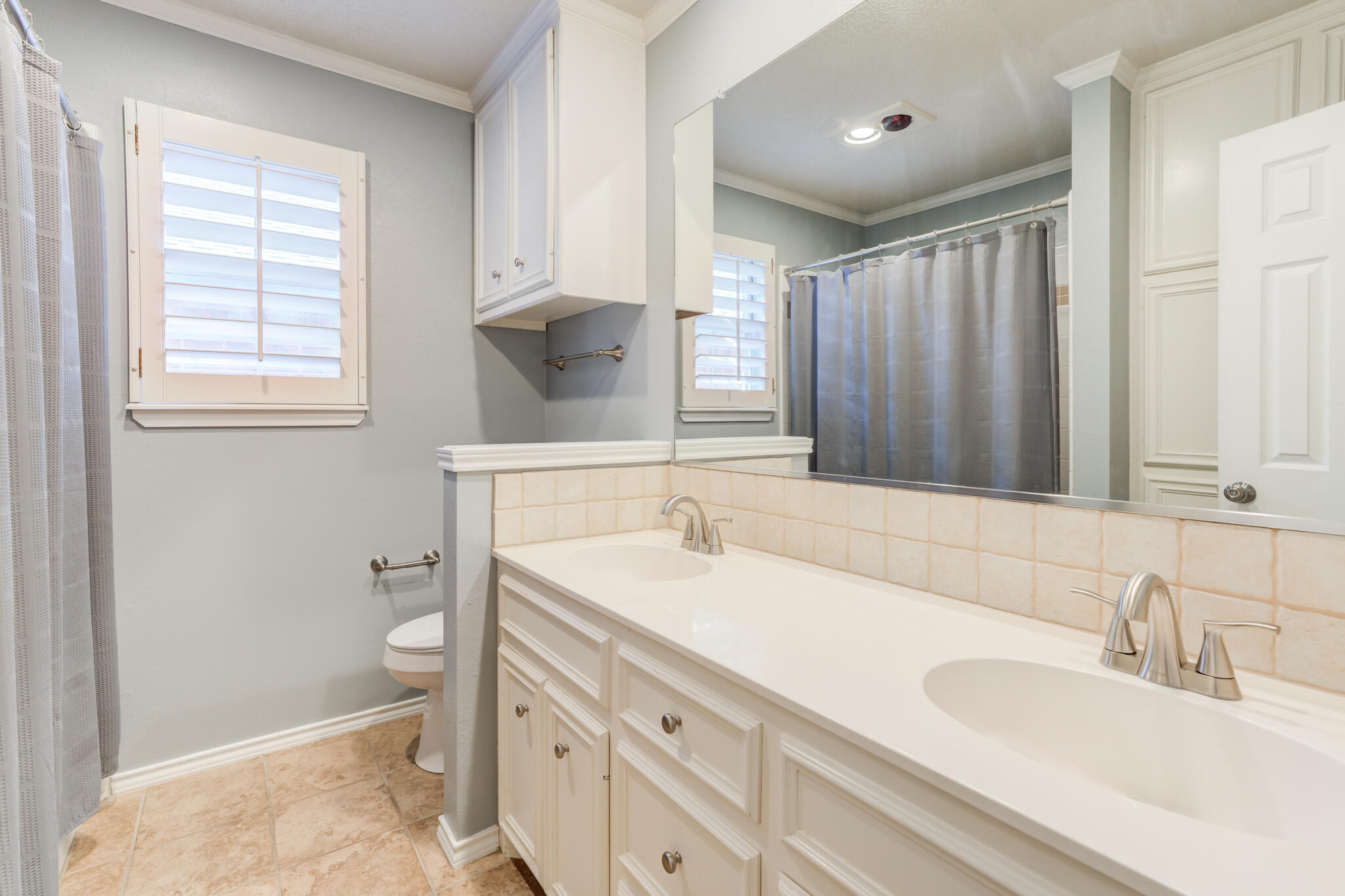5407 68th Street Lubbock, TX 79424 - Photo 30 of 40 a bathroom with a sink and a toilet