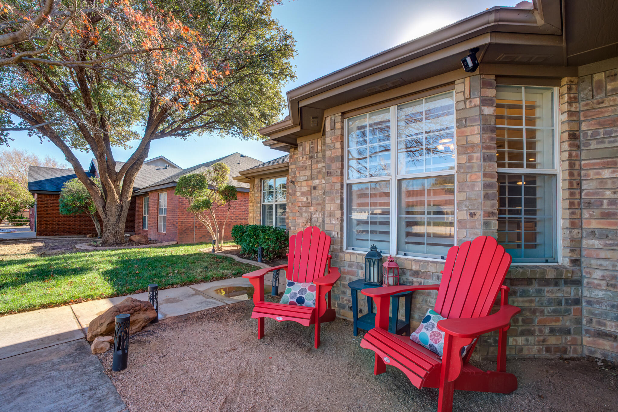 5407 68th Street Lubbock, TX 79424 - Photo 3 of 40 a view of a deck with a table and chairs