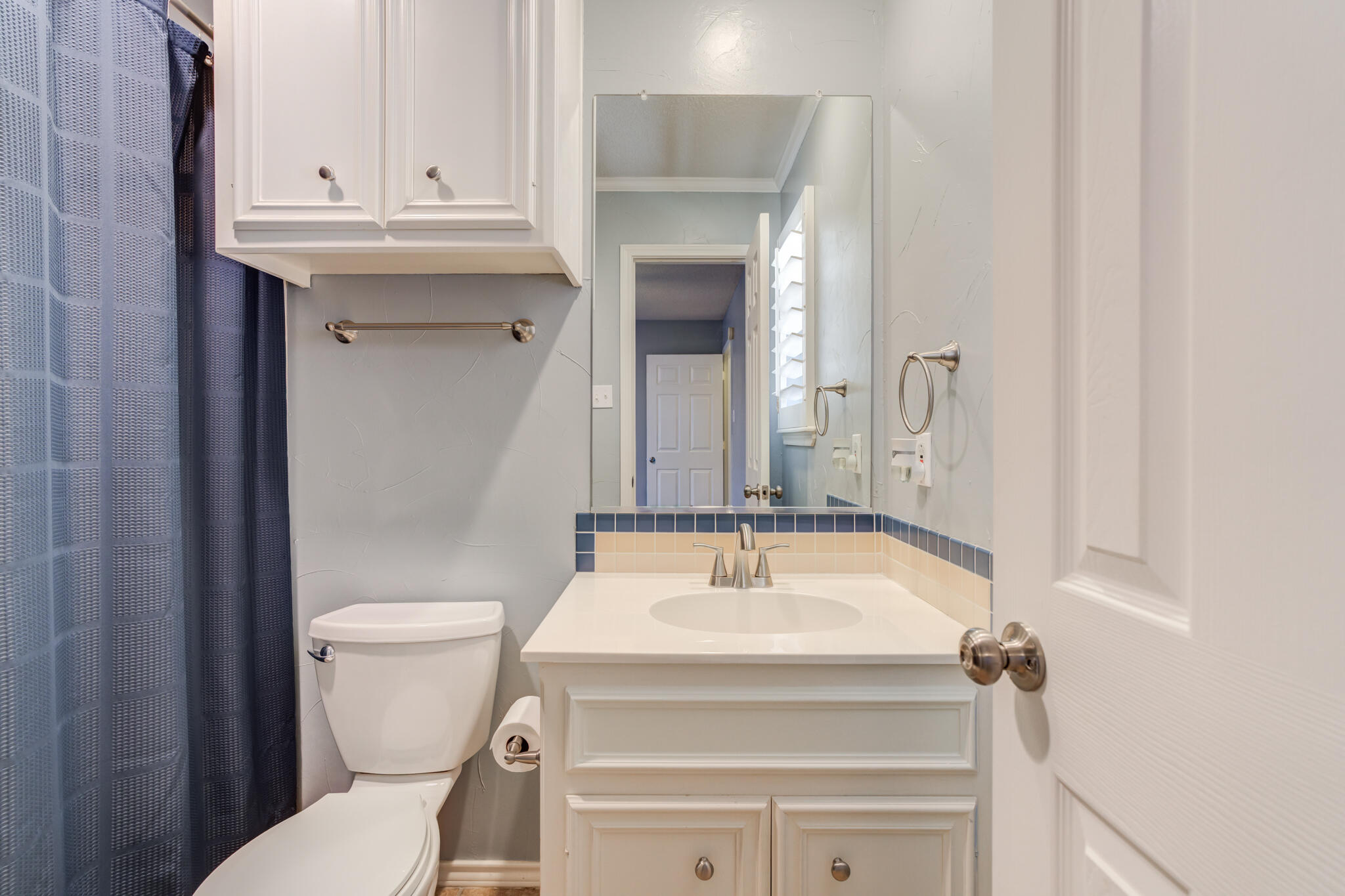 5407 68th Street Lubbock, TX 79424 - Photo 35 of 40 a bathroom with a sink and a toilet