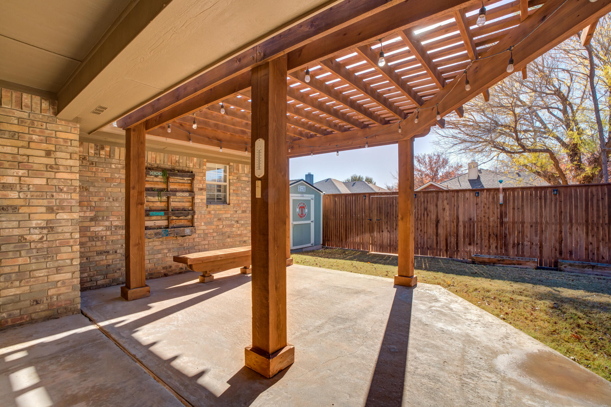5407 68th Street Lubbock, TX 79424 - Photo 36 of 40 a view of a backyard with a fence