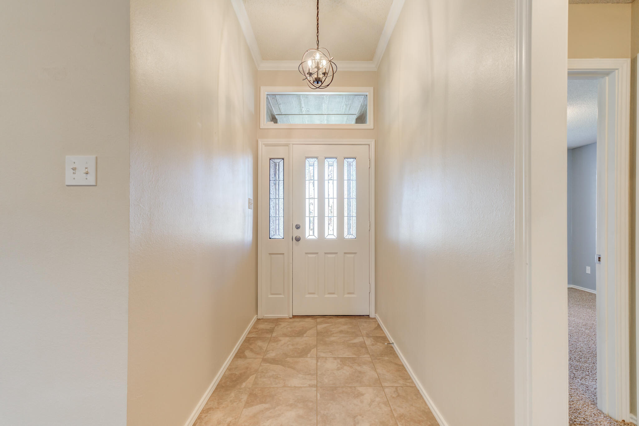 5407 68th Street Lubbock, TX 79424 - Photo 5 of 40 a view of a hallway with front door