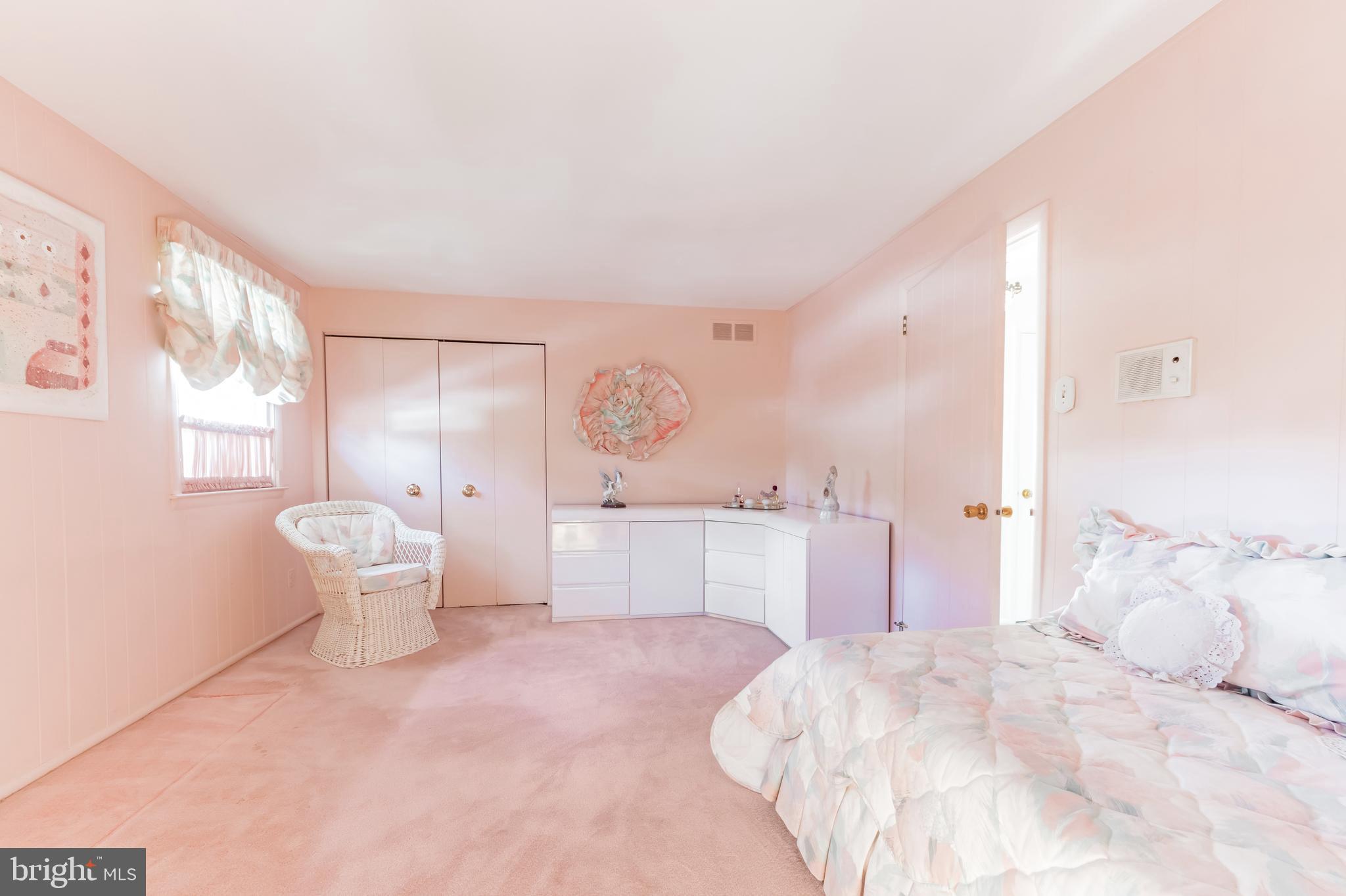 9667 Pine Road Philadelphia, PA 19115 - Photo 18 of 30 a spacious bedroom with a bed and a large window