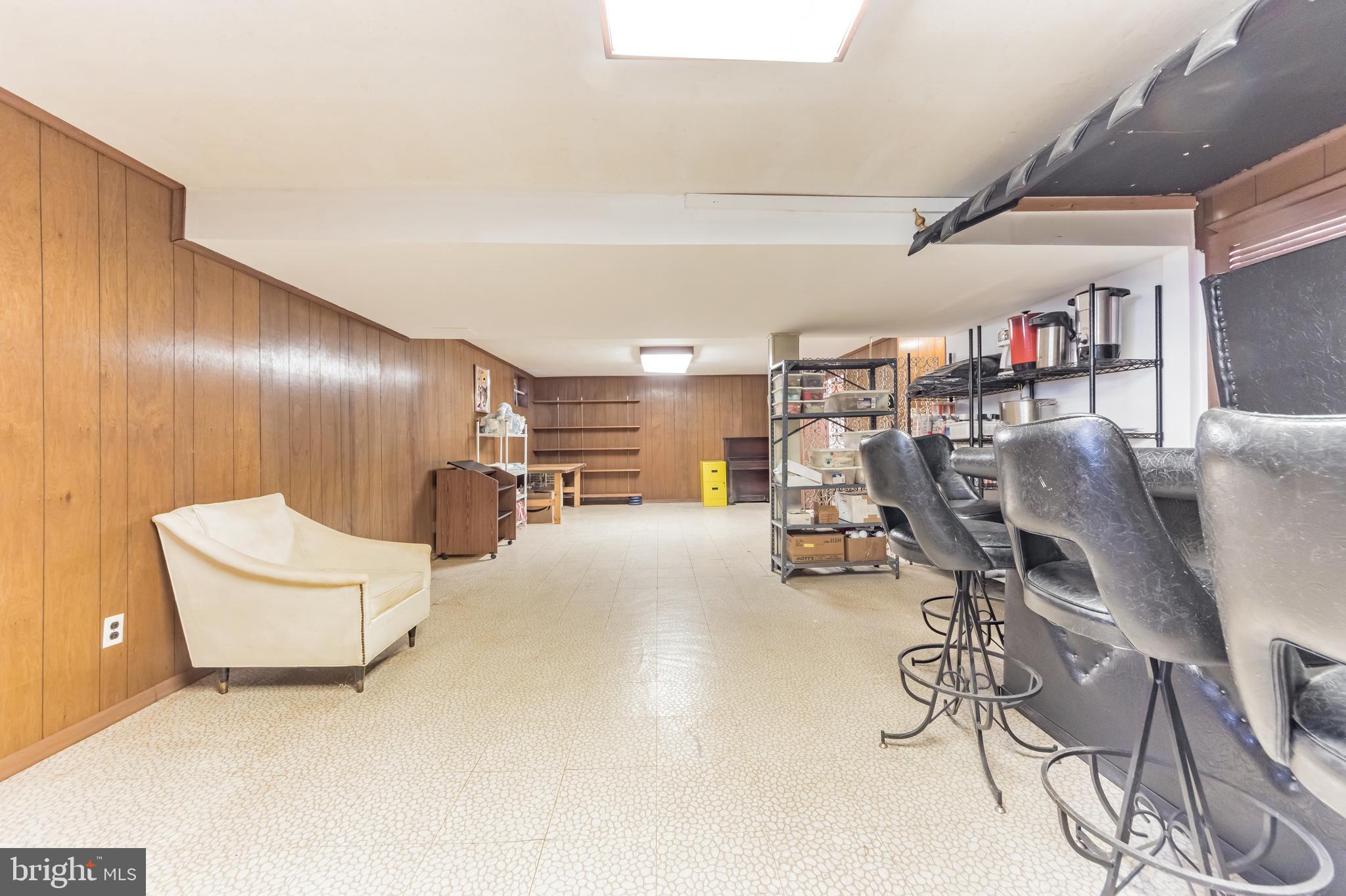 9667 Pine Road Philadelphia, PA 19115 - Photo 25 of 30 a view of a livingroom with furniture and a gym
