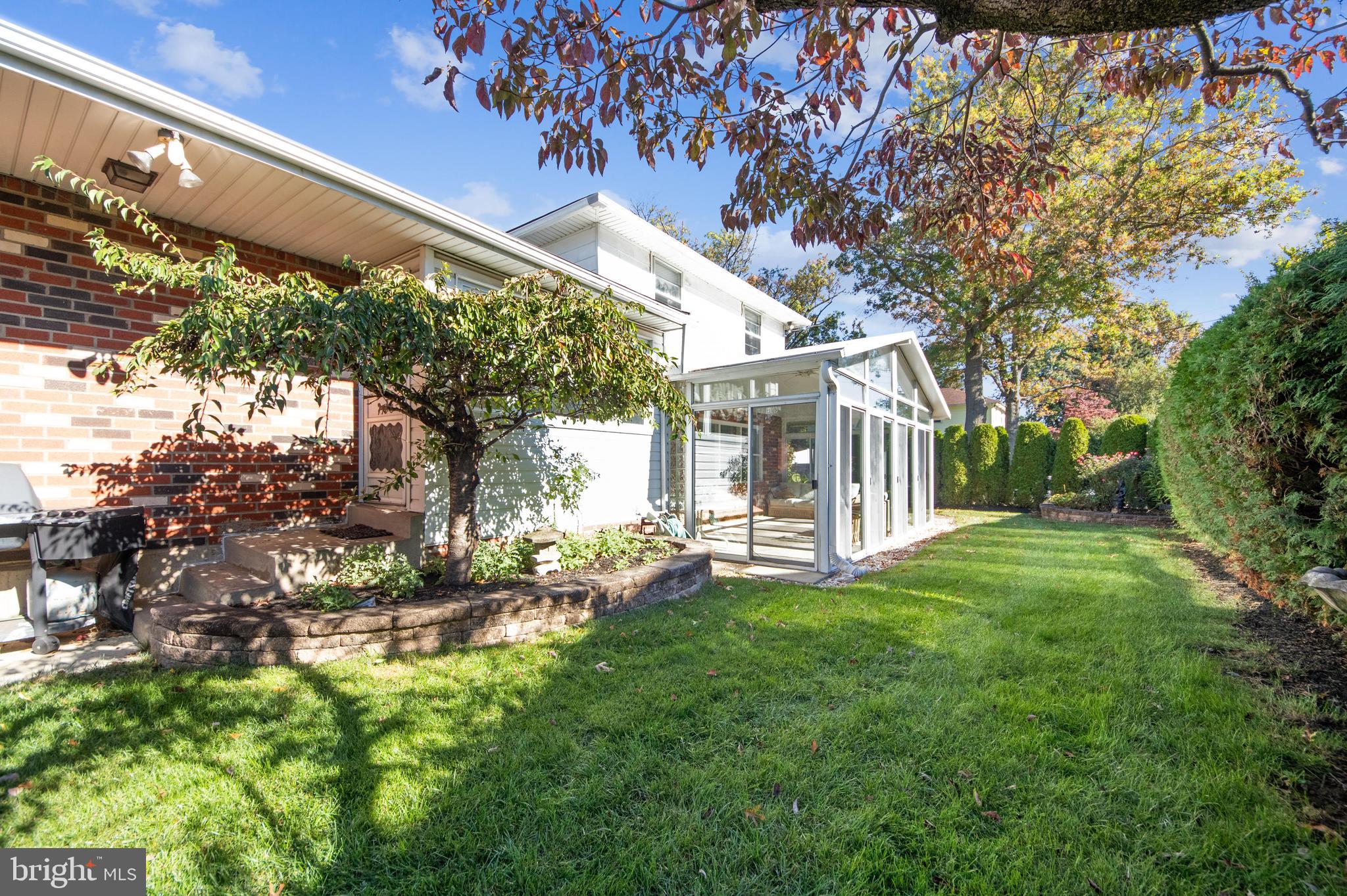 9667 Pine Road Philadelphia, PA 19115 - Photo 28 of 30 a view of a house with a yard porch and sitting area