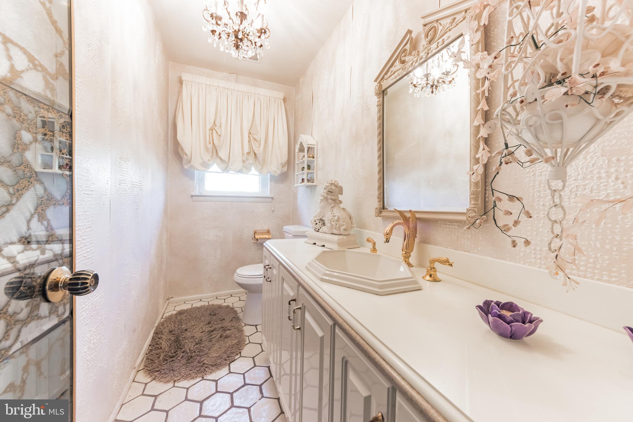 9667 Pine Road Philadelphia, PA 19115 - Photo 5 of 30 a bathroom with a sink toilet and a mirror
