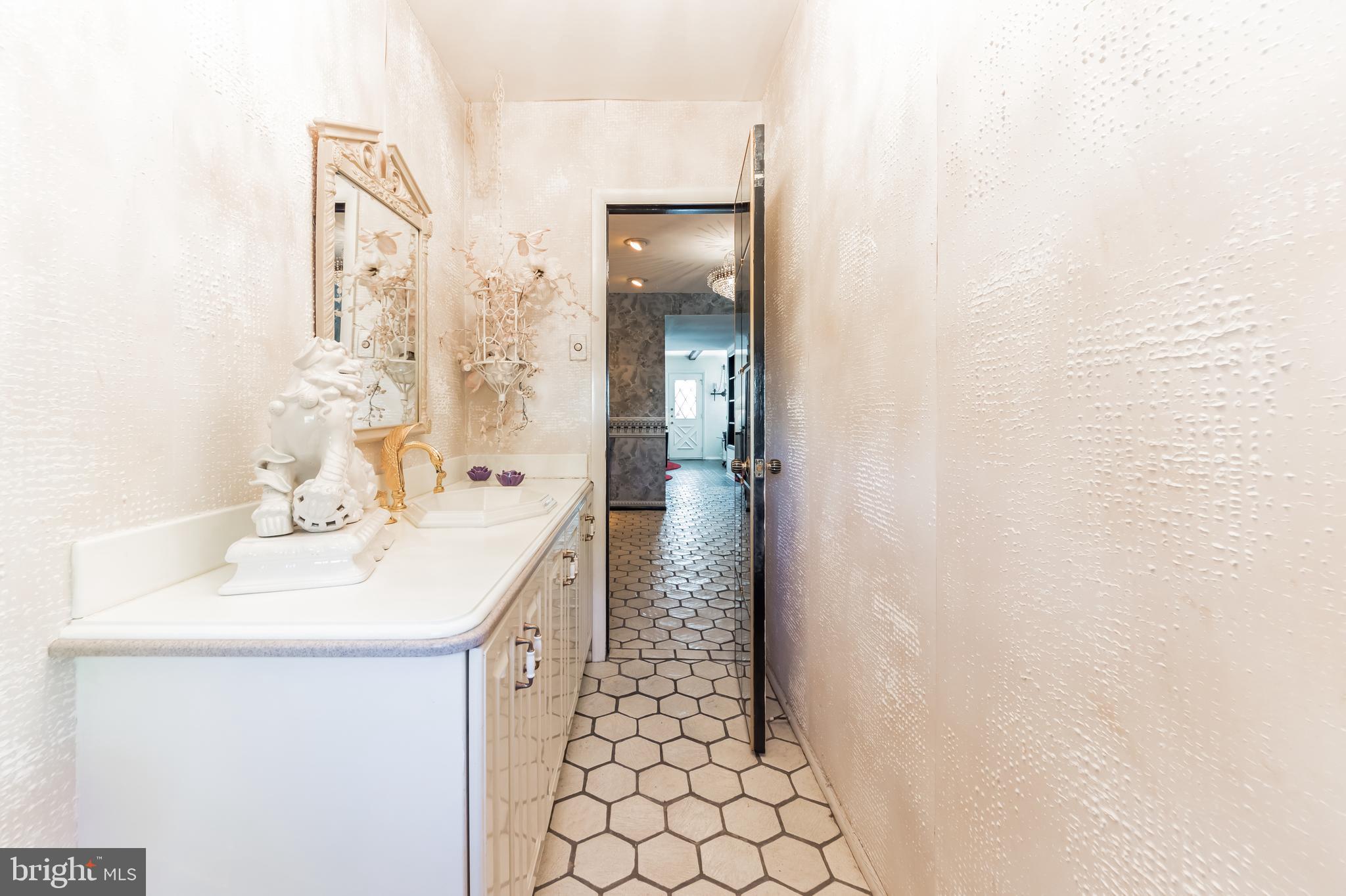 9667 Pine Road Philadelphia, PA 19115 - Photo 6 of 30 a bathroom with a sink a toilet and mirror