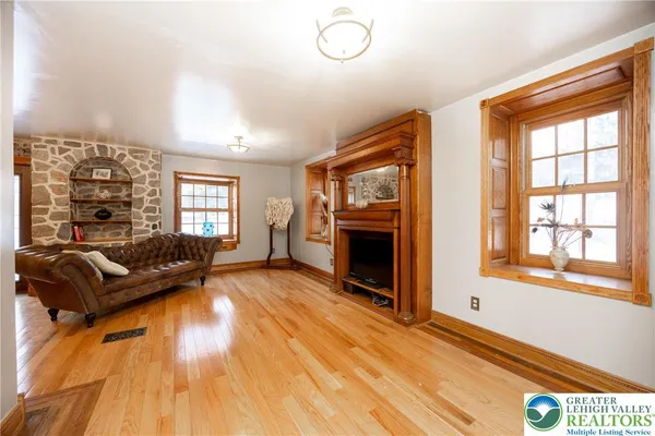 a living room with furniture and a fireplace