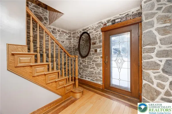 a view of entryway with wooden floor