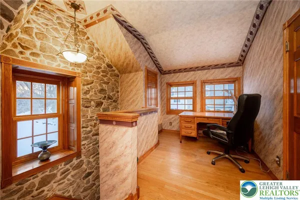 a bedroom with furniture and a window