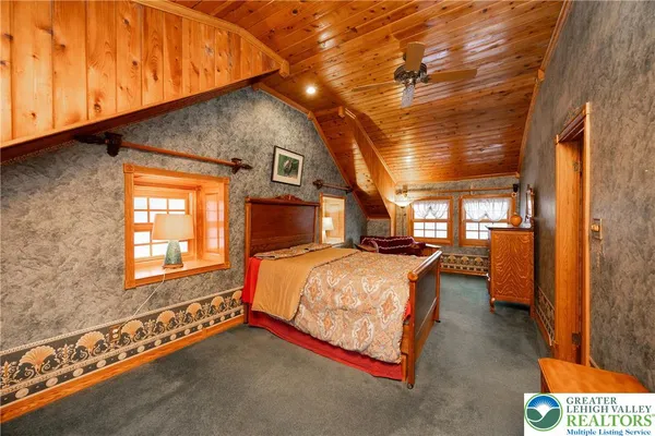 a bed room with a bed and a window