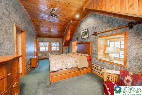 a bedroom with bed and window