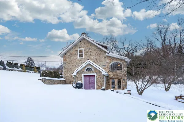 a view of house with yard in front of it