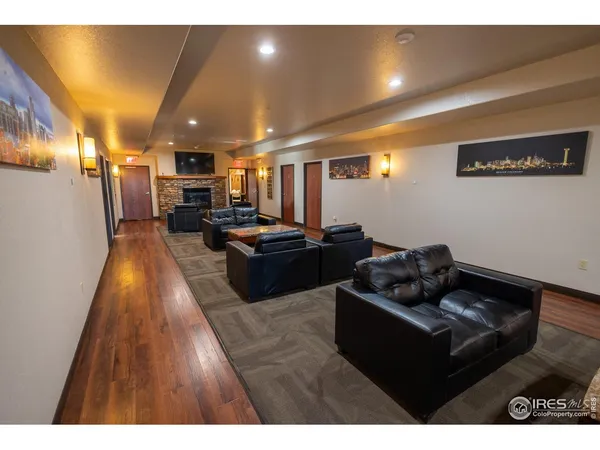 a living room with furniture and kitchen view