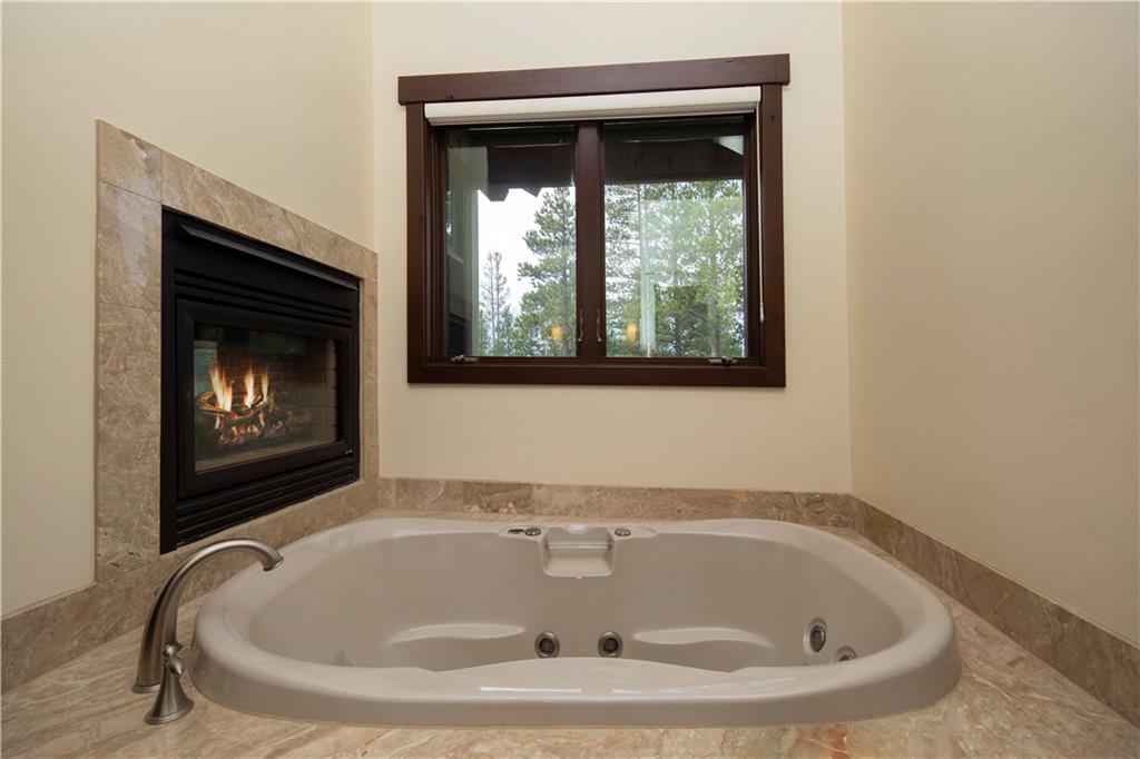 29 Rounds Road Breckenridge, CO 80424 - Photo 14 of 35 a white bath tub sitting in a bathroom