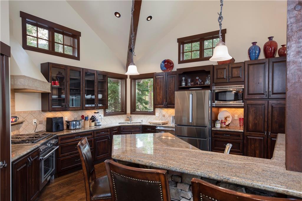 29 Rounds Road Breckenridge, CO 80424 - Photo 5 of 35 a kitchen with stainless steel appliances granite countertop a stove a sink and a refrigerator