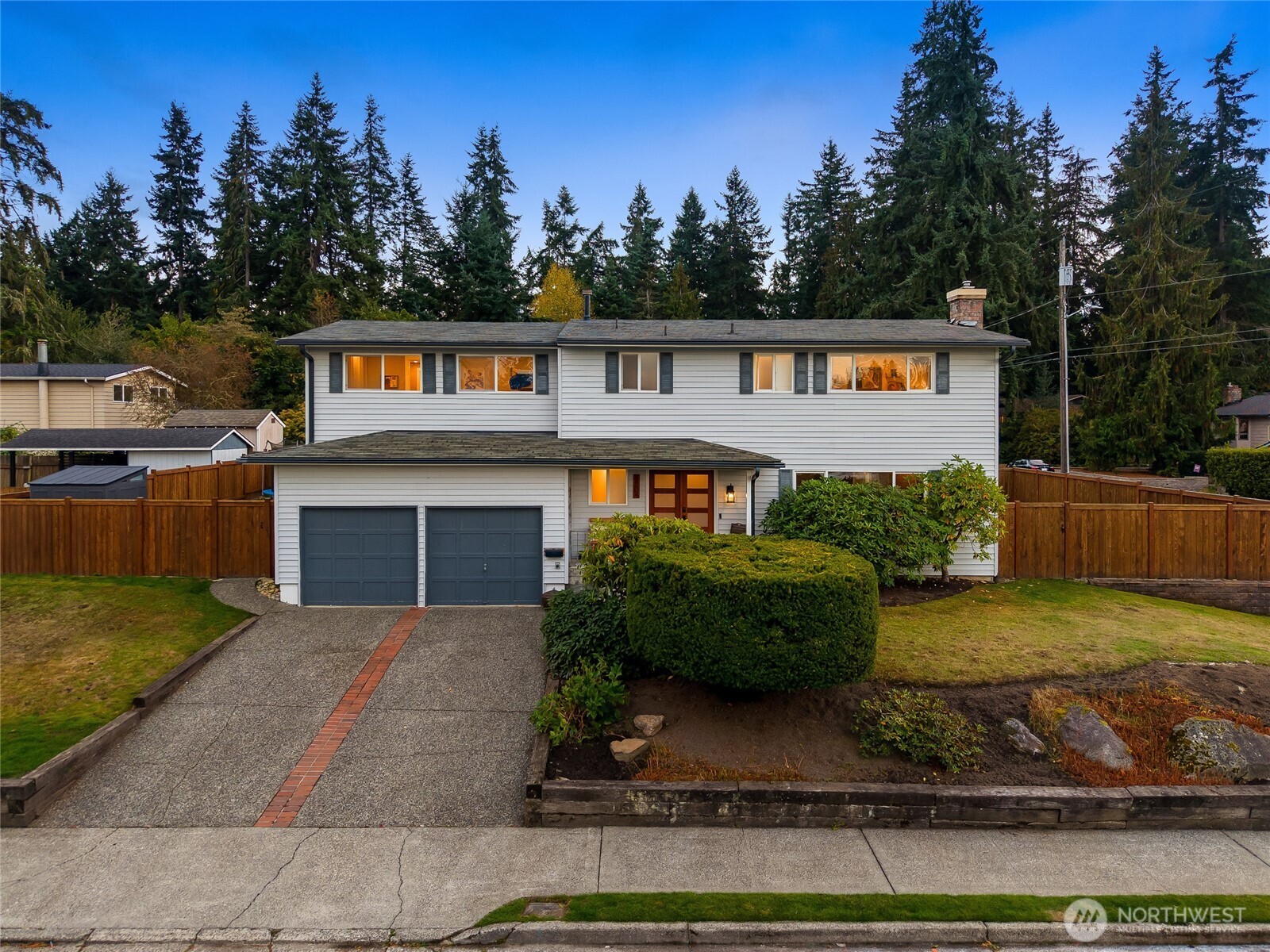 8804 209th Place Southwest Edmonds, WA 98026 - Photo 1 of 35 a front view of a house with a yard and garage