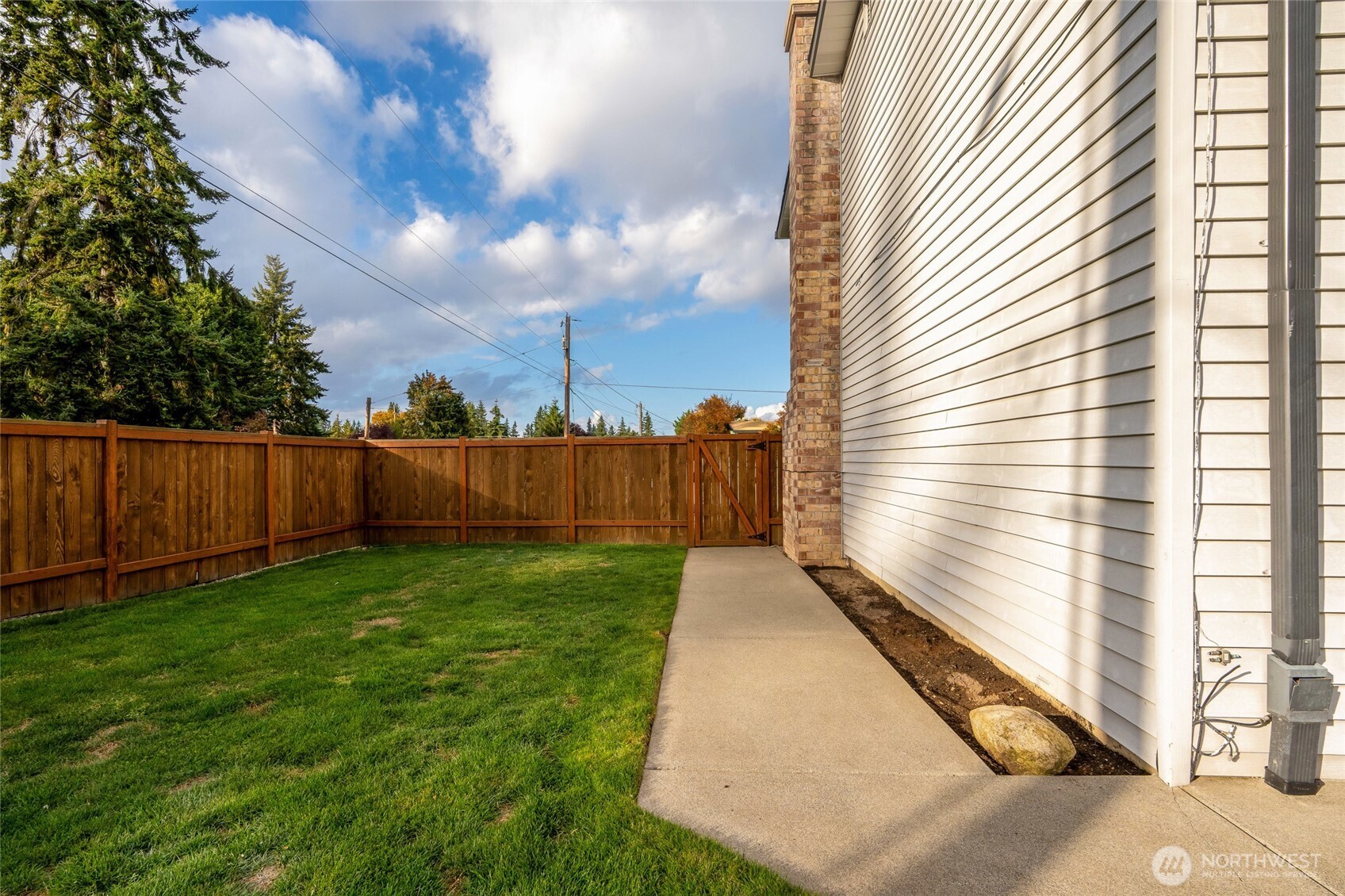 8804 209th Place Southwest Edmonds, WA 98026 - Photo 30 of 35 a view of a backyard with wooden fence
