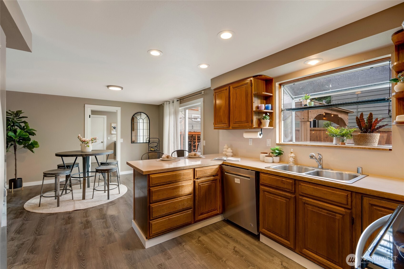 8804 209th Place Southwest Edmonds, WA 98026 - Photo 10 of 35 a kitchen with a sink stove and cabinets