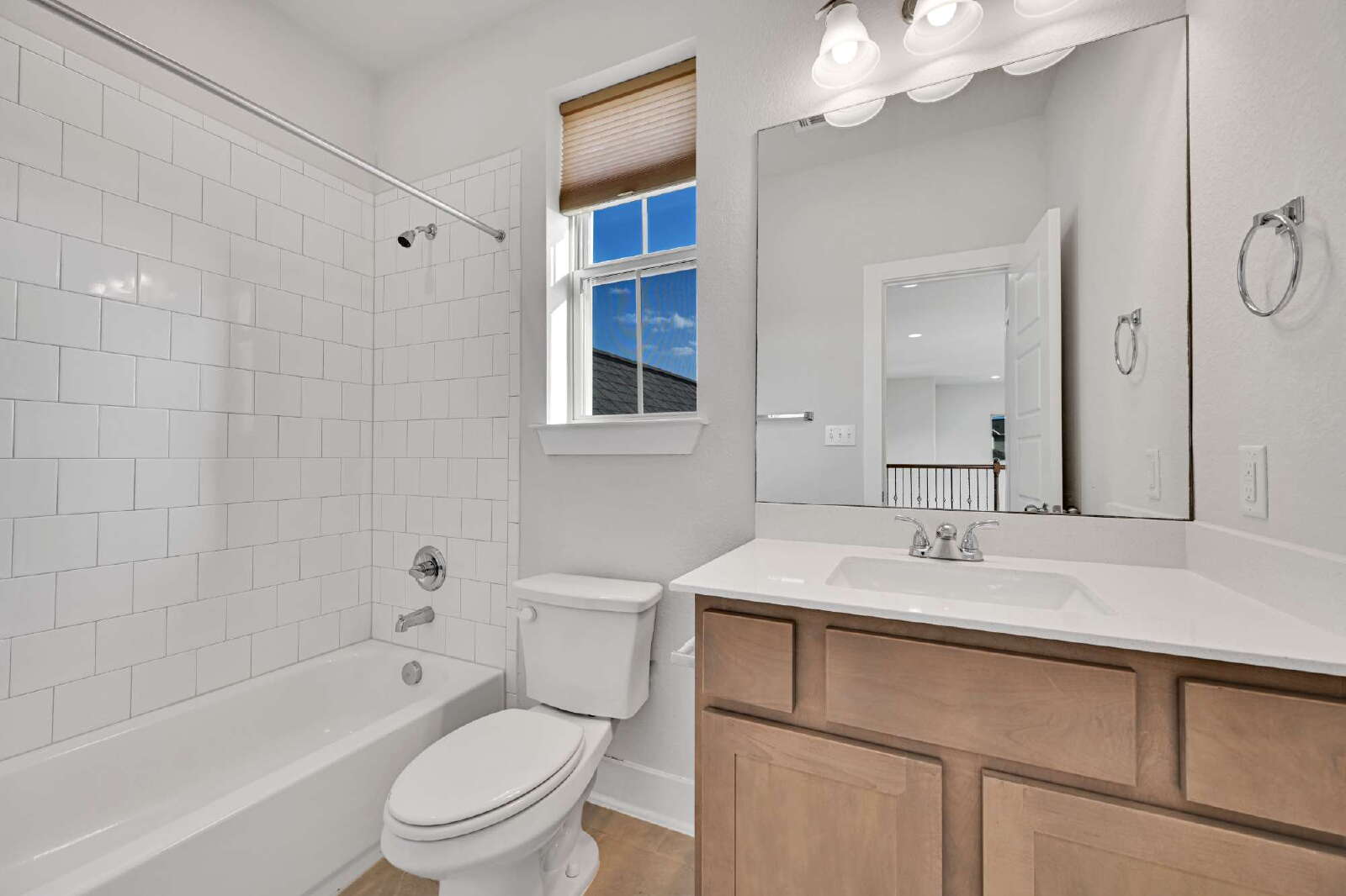 4420 Kings Cross Road Pflugerville, TX 78660 - Photo 20 of 25 Clean lines and classic subway tile define this inviting secondary bathroom.