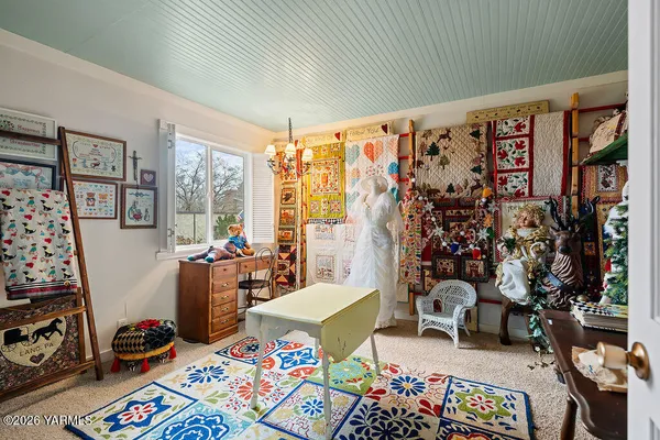 a bedroom with furniture and a window
