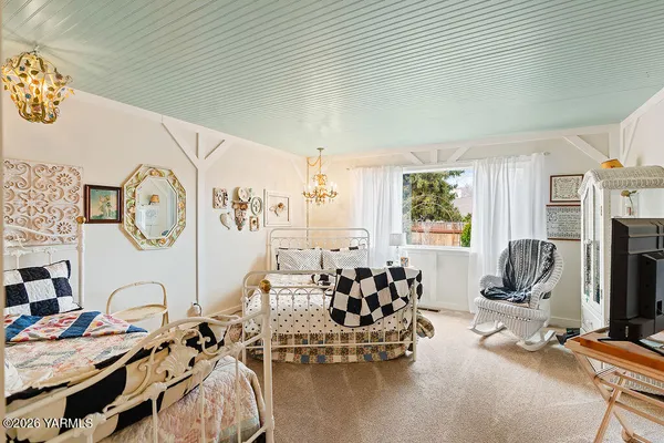 a view of a livingroom with furniture and a window
