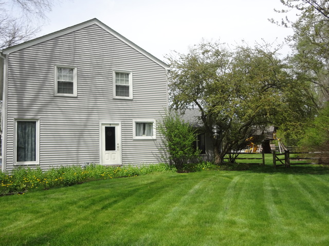 5N565 Billy Burns Road Wayne, IL 60184 - Photo 23 of 25 a front view of house with yard and green space