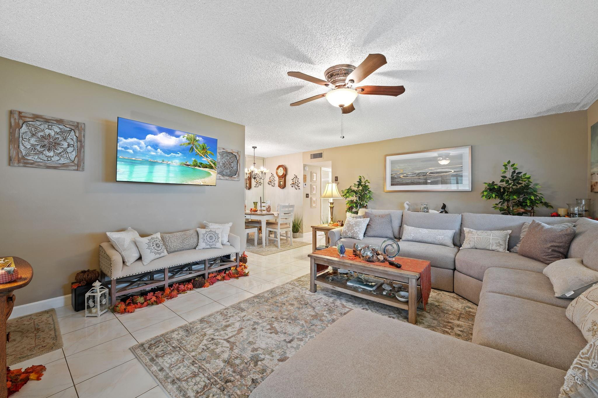 152 High Point Boulevard, Unit D Delray Beach, FL 33445 - Photo 11 of 34 a living room with furniture and a rug