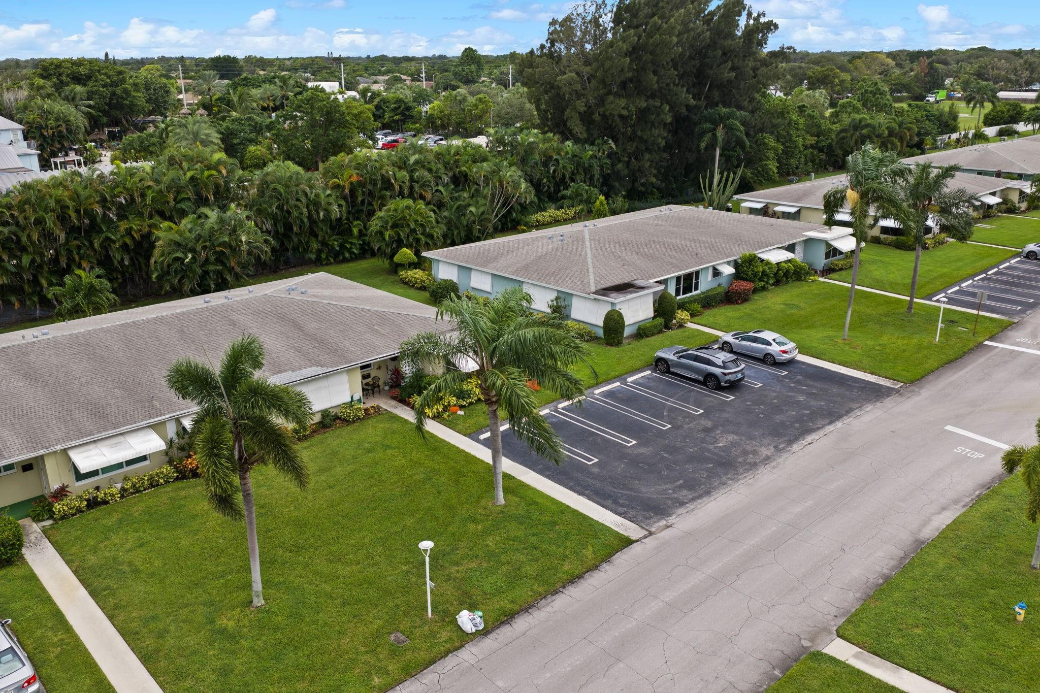 152 High Point Boulevard, Unit D Delray Beach, FL 33445 - Photo 2 of 34 an aerial view of a house with yard