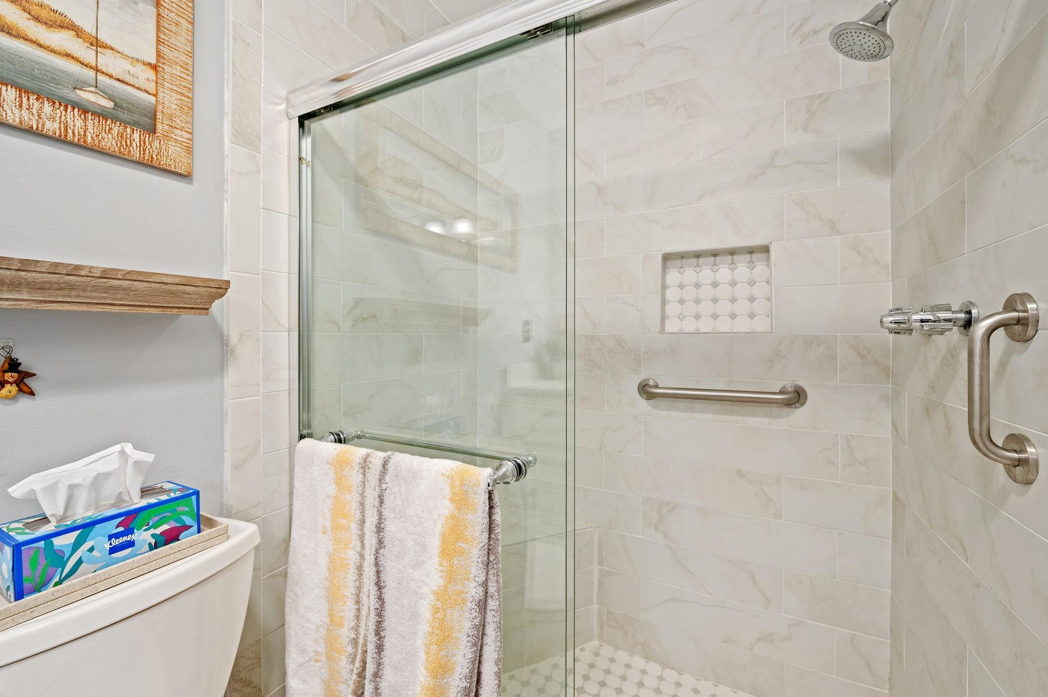 152 High Point Boulevard, Unit D Delray Beach, FL 33445 - Photo 21 of 34 a bathroom with a shower curtain and a sink