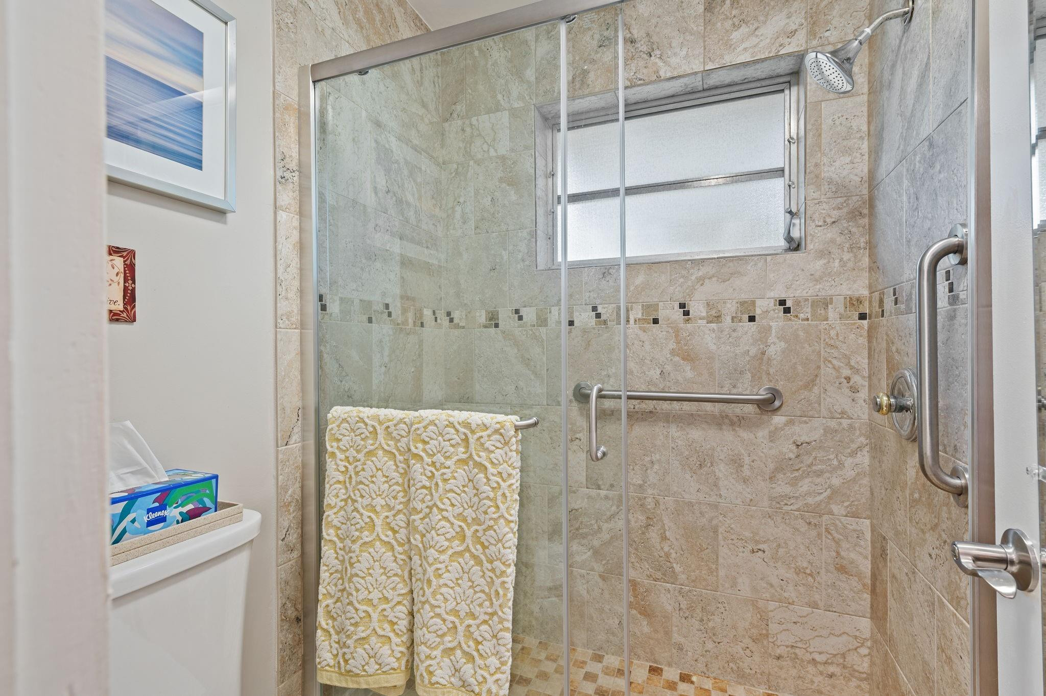 152 High Point Boulevard, Unit D Delray Beach, FL 33445 - Photo 25 of 34 a bathroom with a shower