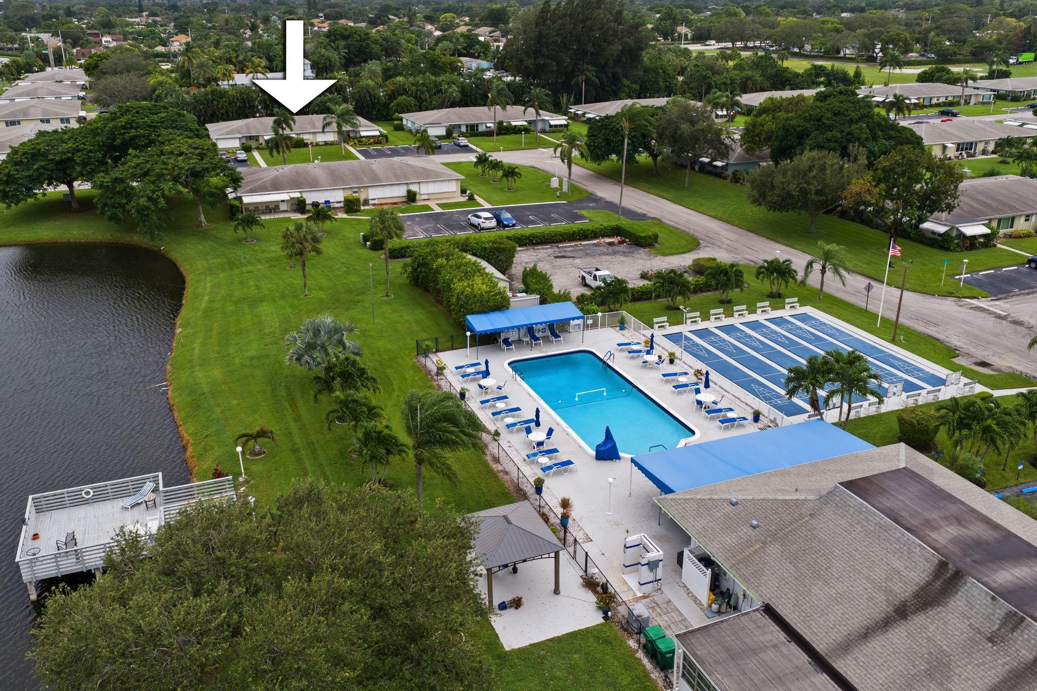 152 High Point Boulevard, Unit D Delray Beach, FL 33445 - Photo 33 of 34 an aerial view of a house with garden space and street view