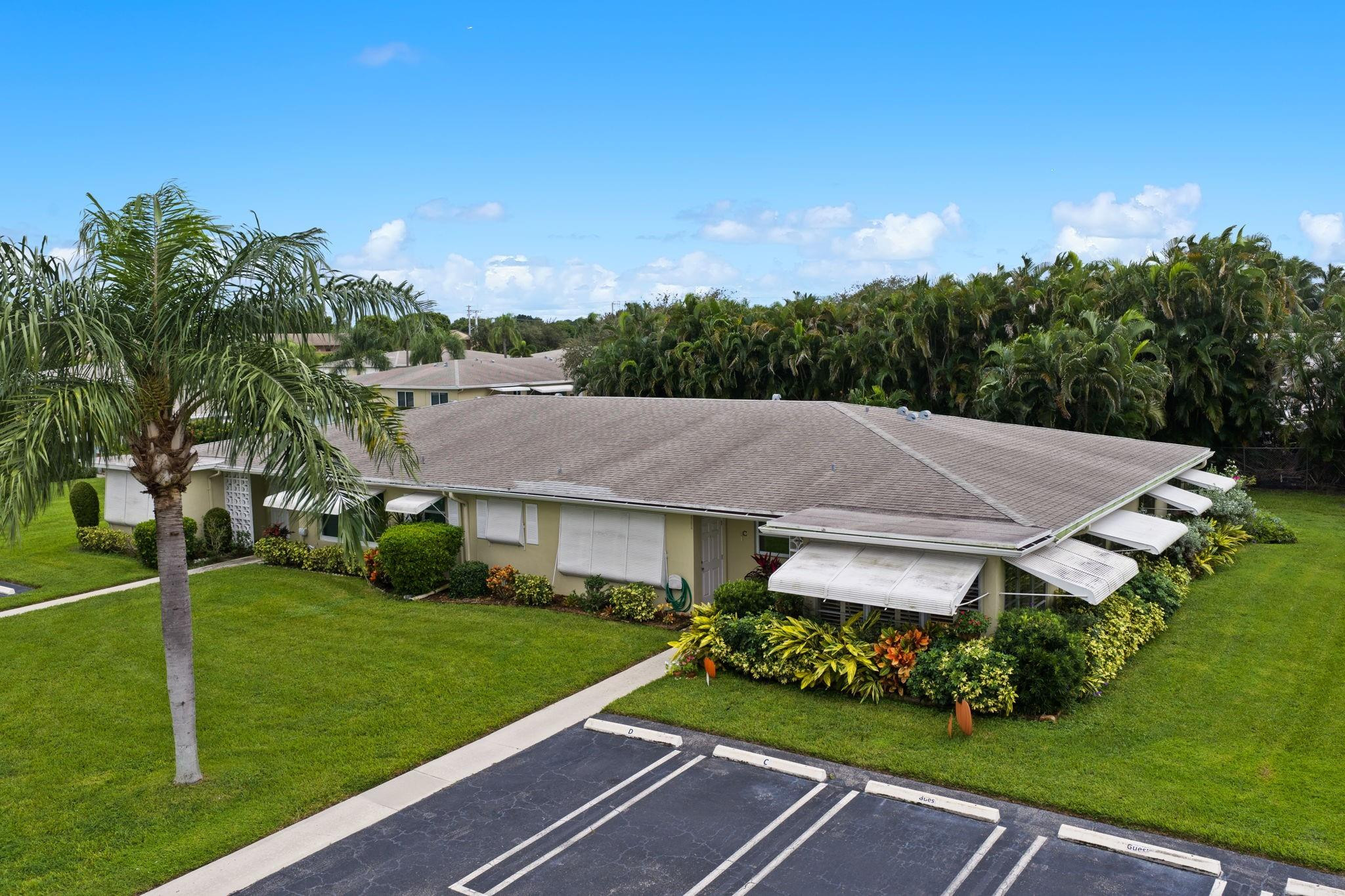 152 High Point Boulevard, Unit D Delray Beach, FL 33445 - Photo 4 of 34 a aerial view of a house with garden