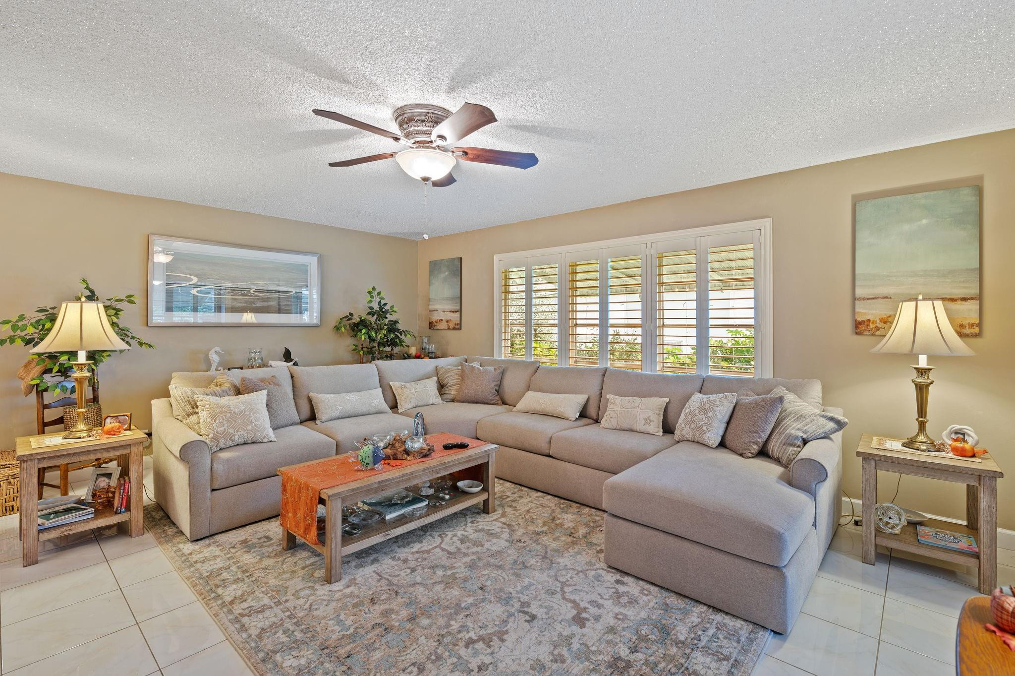 152 High Point Boulevard, Unit D Delray Beach, FL 33445 - Photo 9 of 34 a living room with furniture and a large window