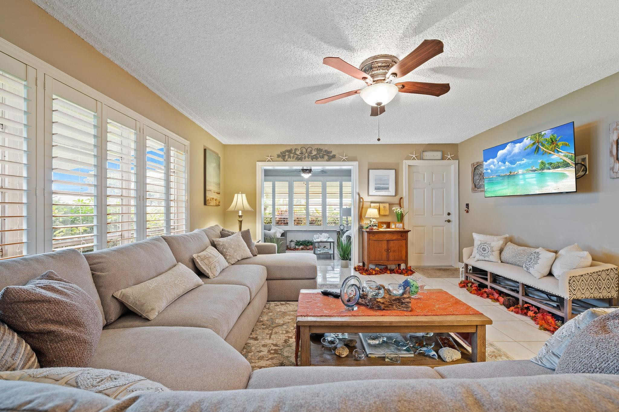 152 High Point Boulevard, Unit D Delray Beach, FL 33445 - Photo 10 of 34 a living room with furniture and a large window