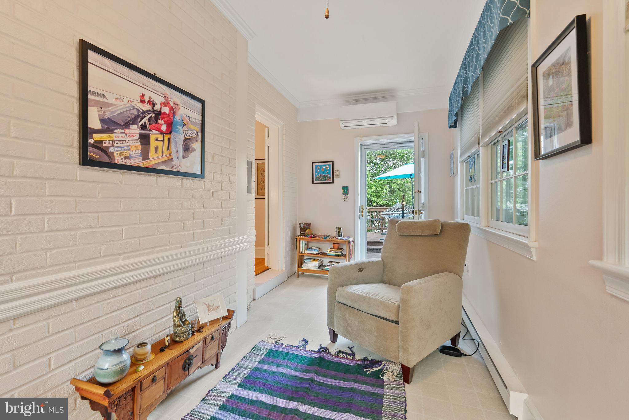 1703 Russell Road Alexandria, VA 22301 - Photo 16 of 42 a living room with furniture and a painting on the wall