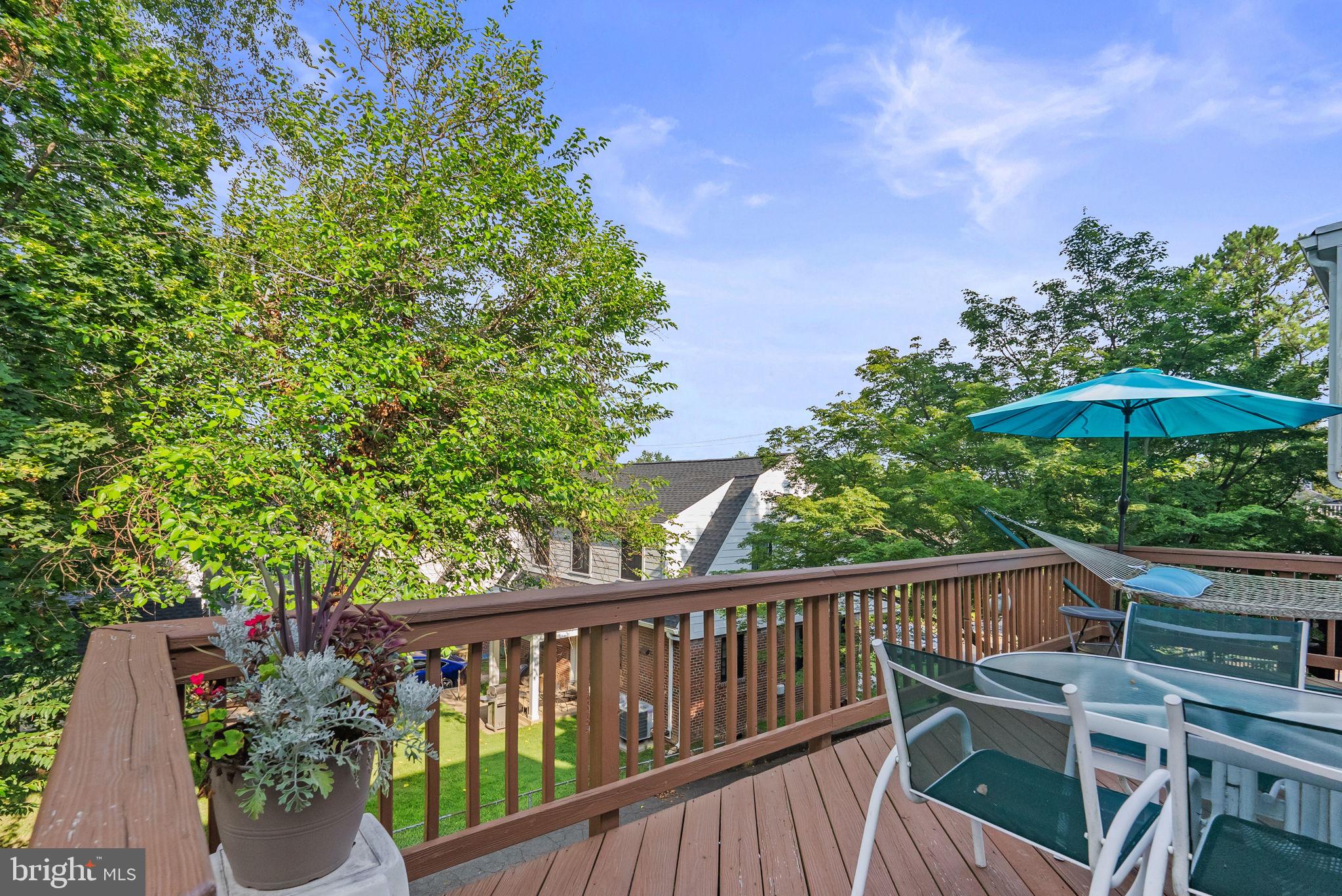 1703 Russell Road Alexandria, VA 22301 - Photo 17 of 42 a balcony with wooden floor and outdoor seating