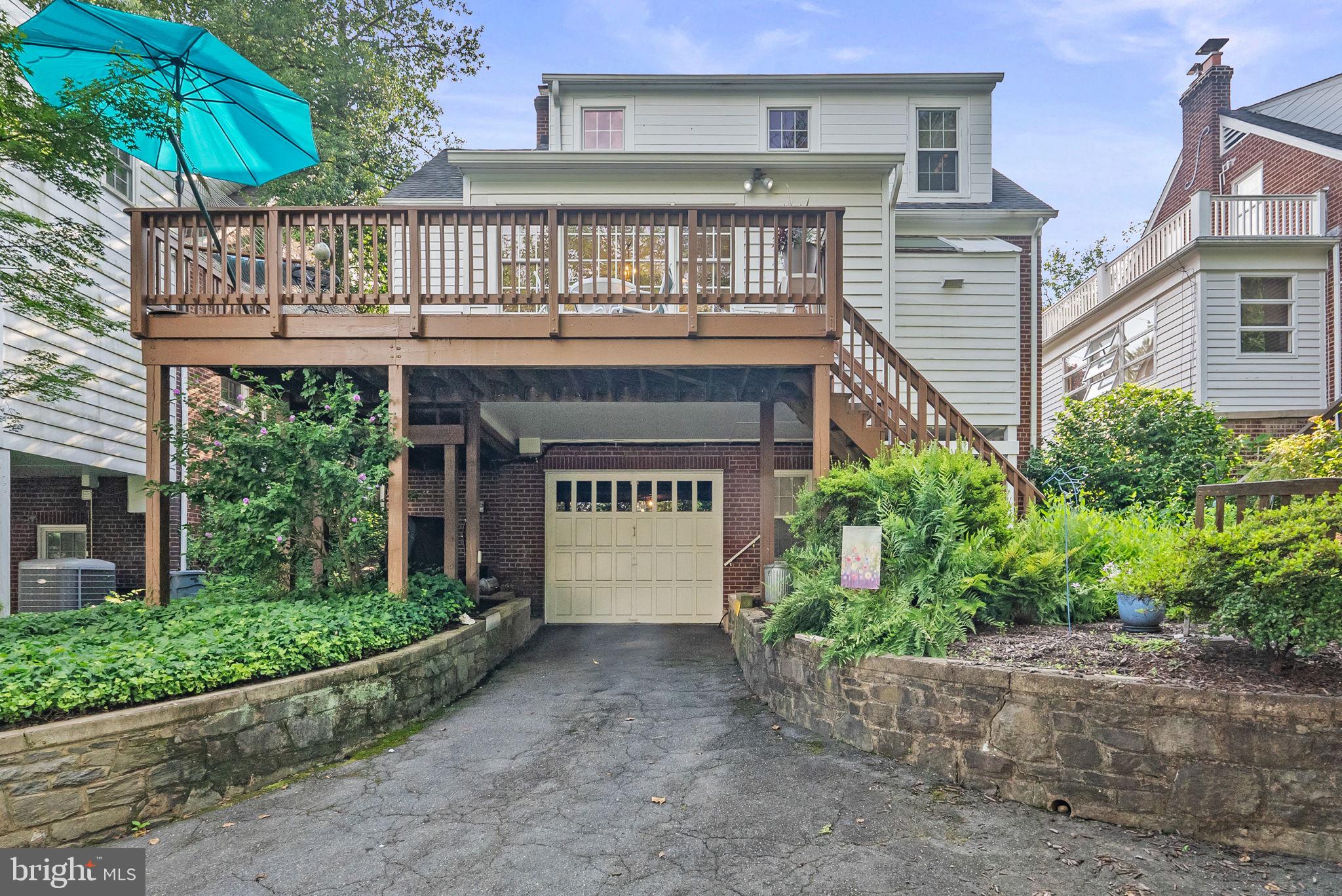 1703 Russell Road Alexandria, VA 22301 - Photo 3 of 42 a front view of a house with a garden