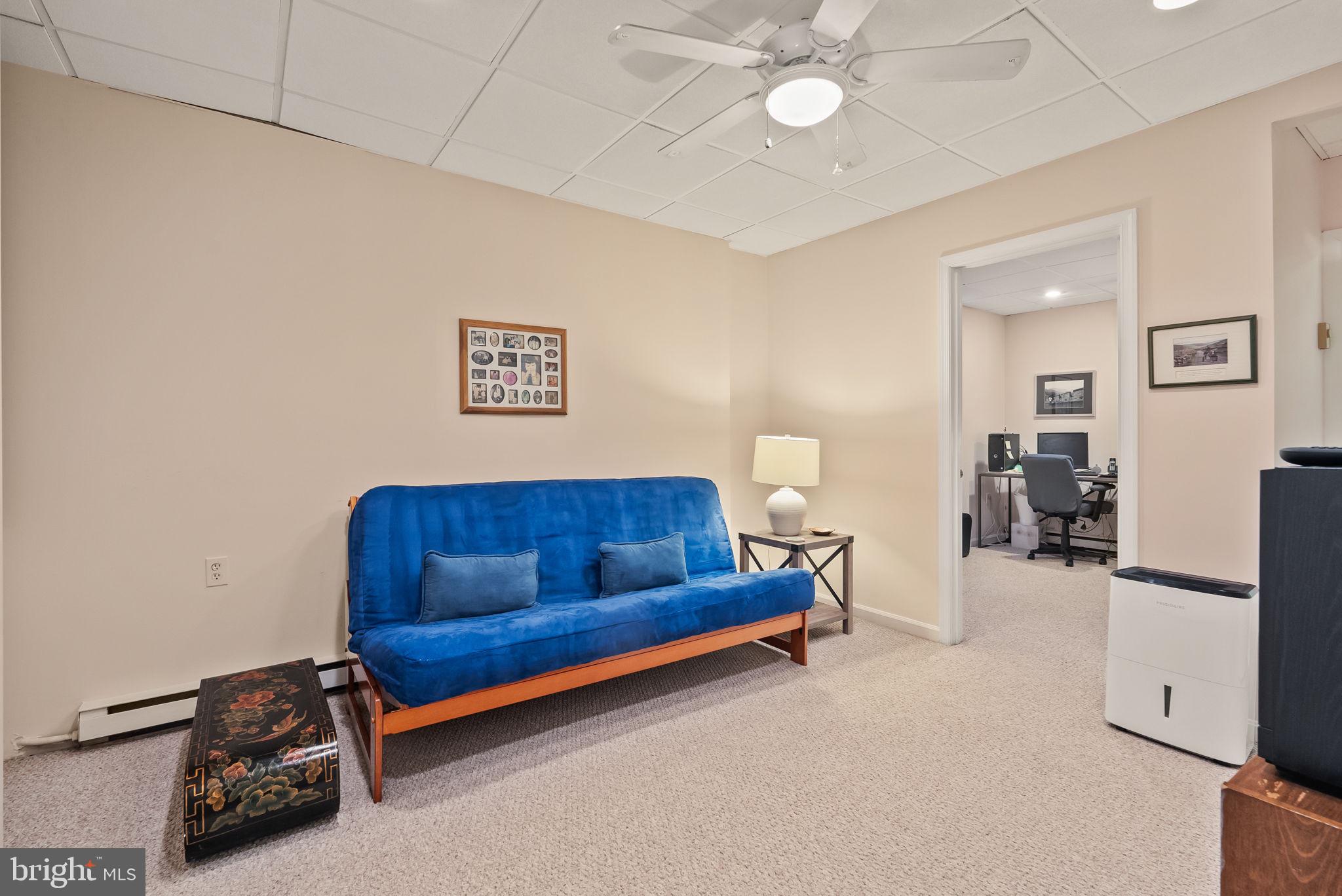 1703 Russell Road Alexandria, VA 22301 - Photo 36 of 42 a living room with furniture and a flat screen tv