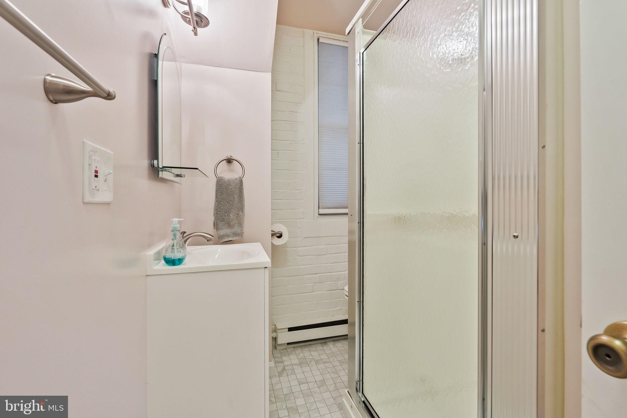 1703 Russell Road Alexandria, VA 22301 - Photo 37 of 42 a bathroom with a sink and a mirror