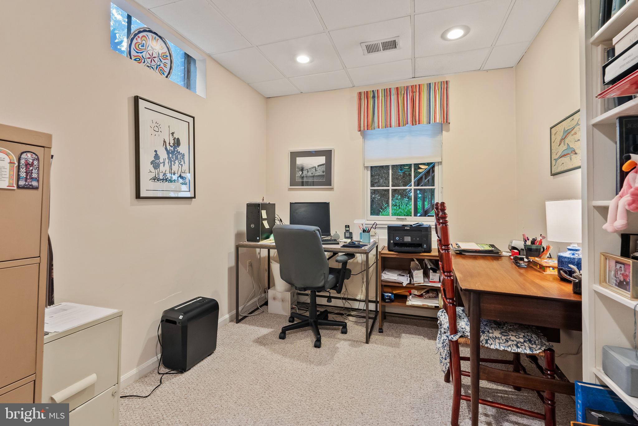 1703 Russell Road Alexandria, VA 22301 - Photo 39 of 42 a view of a workspace with furniture and a window