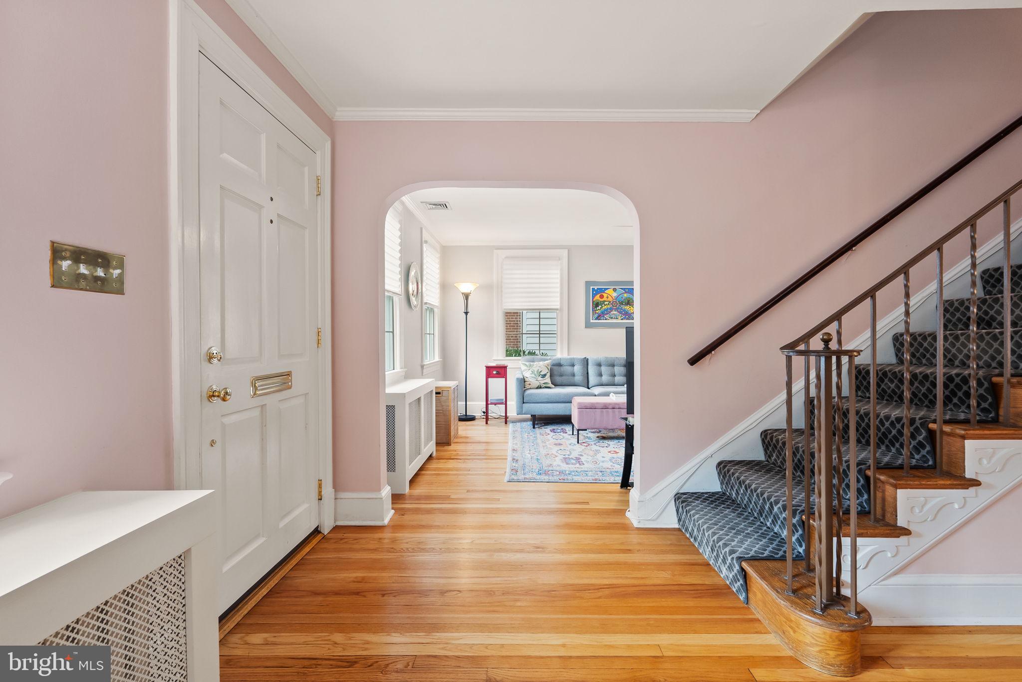 1703 Russell Road Alexandria, VA 22301 - Photo 4 of 42 a view of a hallway view with wooden floor and staircase