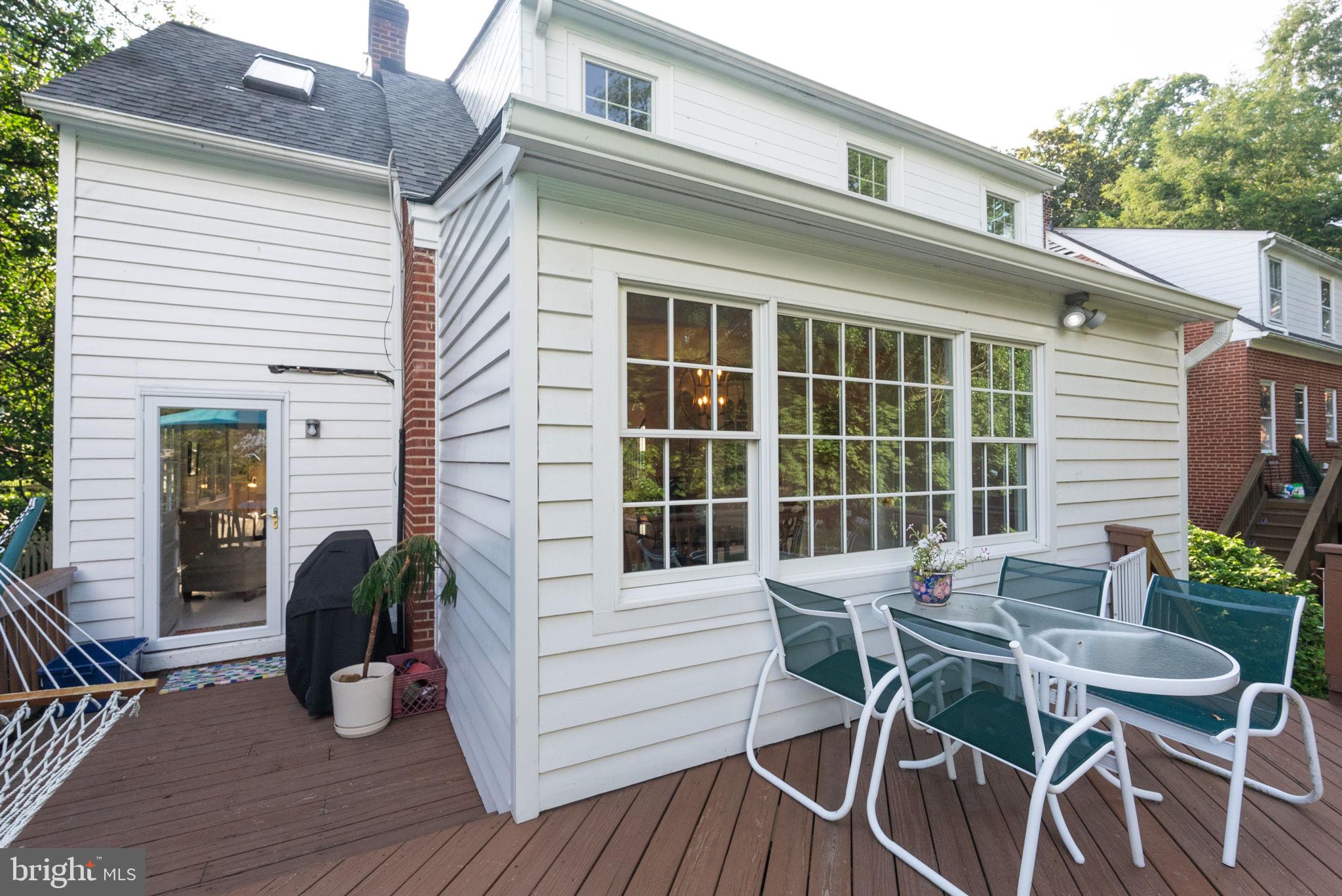 1703 Russell Road Alexandria, VA 22301 - Photo 42 of 42 a view of a patio with table and chairs and wooden floor