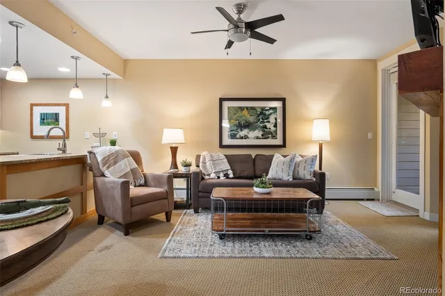 a living room with furniture and a rug