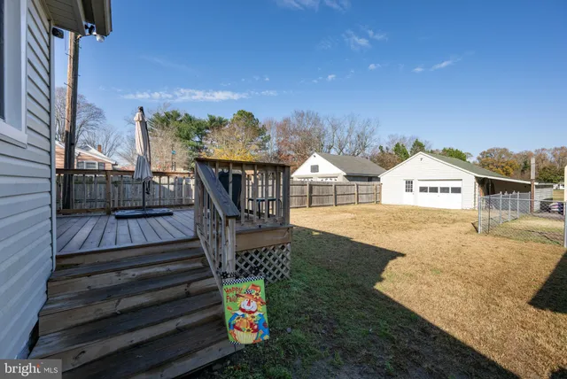 a view of a pathway with a garden