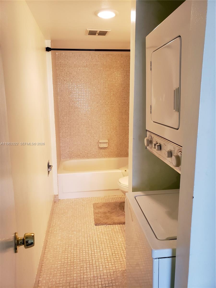 4170 Inverrary Drive, Unit 310 Lauderhill, FL 33319 - Photo 7 of 10 a bathroom with a bathtub and a shower