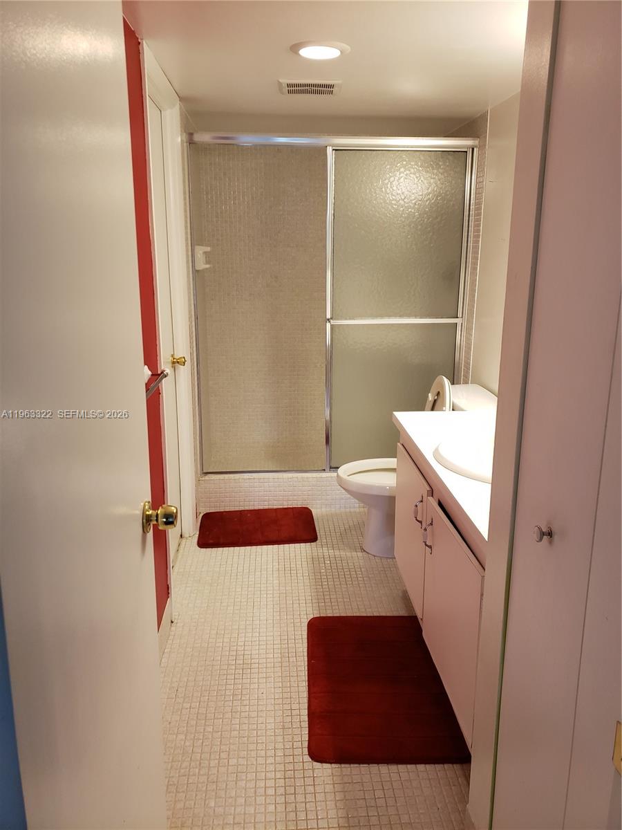 4170 Inverrary Drive, Unit 310 Lauderhill, FL 33319 - Photo 10 of 10 a bathroom with a sink and mirror