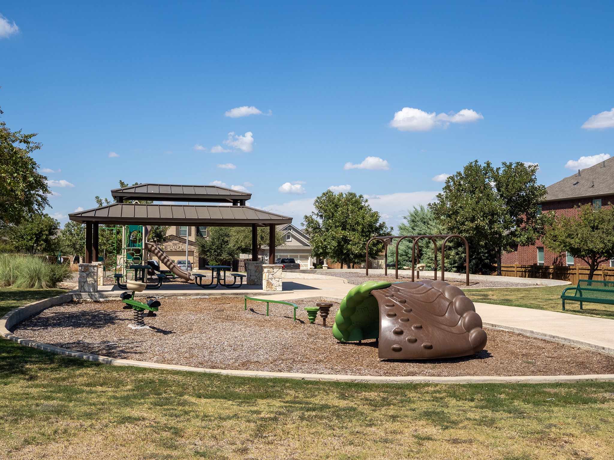 104 Rocroi Drive Georgetown, TX 78626 - Photo 35 of 40 An inviting neighborhood playground features modern play structures, a spacious pavilion, and paved walking paths.