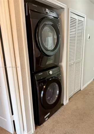 a bedroom with a bed and a flat tv screen on the dresser