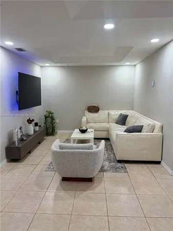 a view of a workspace with furniture